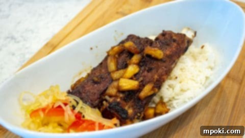 A serving of Instant Pot Pork Spare Ribs, garnished and ready to eat.