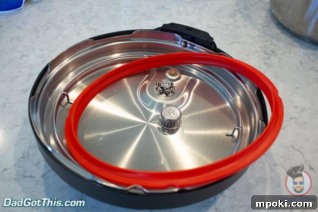 Close-up view of the Instant Pot lid, highlighting its components like the steam release valve and sealing ring.