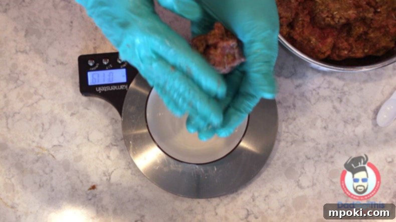 Authentic Italian Meatballs from Scratch 5 Gloved hands gently rolling meatball mixture into a perfect sphere, demonstrating the delicate technique required for ideal texture.