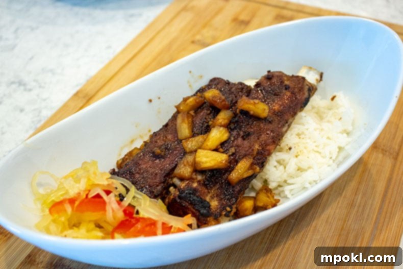 Instant Pot Korean BBQ Spare Ribs: Sweet, Sticky, and Tender 2 Instant Pot Pork Spare Ribs over white rice with atchara.