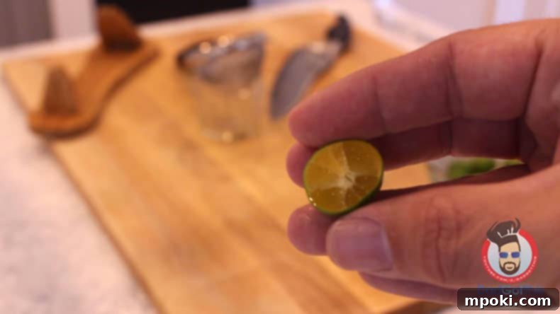 Delicious Instant Pot Pork Bistek Tagalog 7 a cut calamansi being held