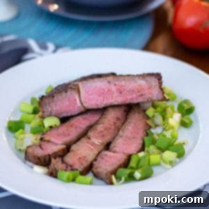 Unlocking Steak Perfection with Reverse Sear 10 A reverse seared steak on a white plate ready to be served