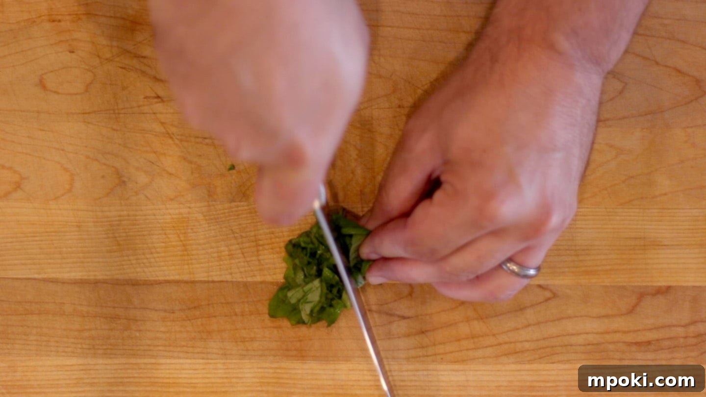 Crab-Stuffed Mushrooms: Air Fryer and Oven Delights 3 chopping basil for seafood stuffed mushrooms