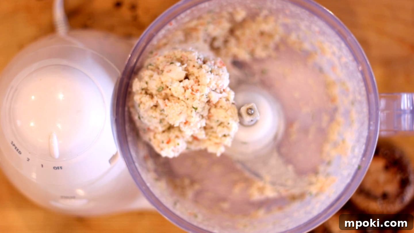 Crab-Stuffed Mushrooms: Air Fryer and Oven Delights 7 a ball of ingredients in a food processor for seafood stuffed mushrooms