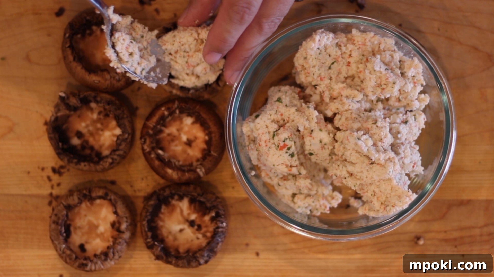 Crab-Stuffed Mushrooms: Air Fryer and Oven Delights 8 putting filling inside mushrooms