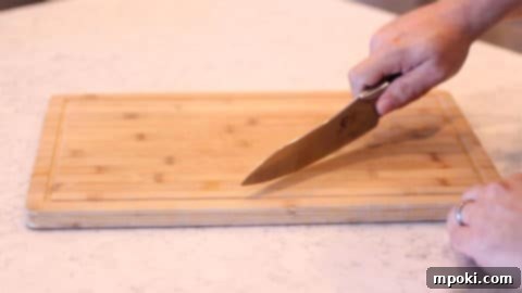 Anchor Your Cutting Board for a Steady Slice 8 knife cutting on a cutting board