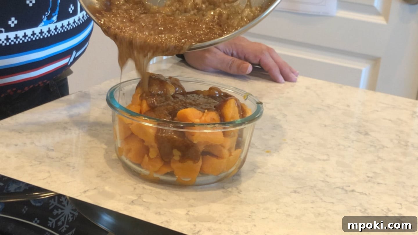 Air Fryer Candied Yams and Toasted Marshmallows 5 Pouring the warm sugar and spice mixture over drained yams in a baking dish