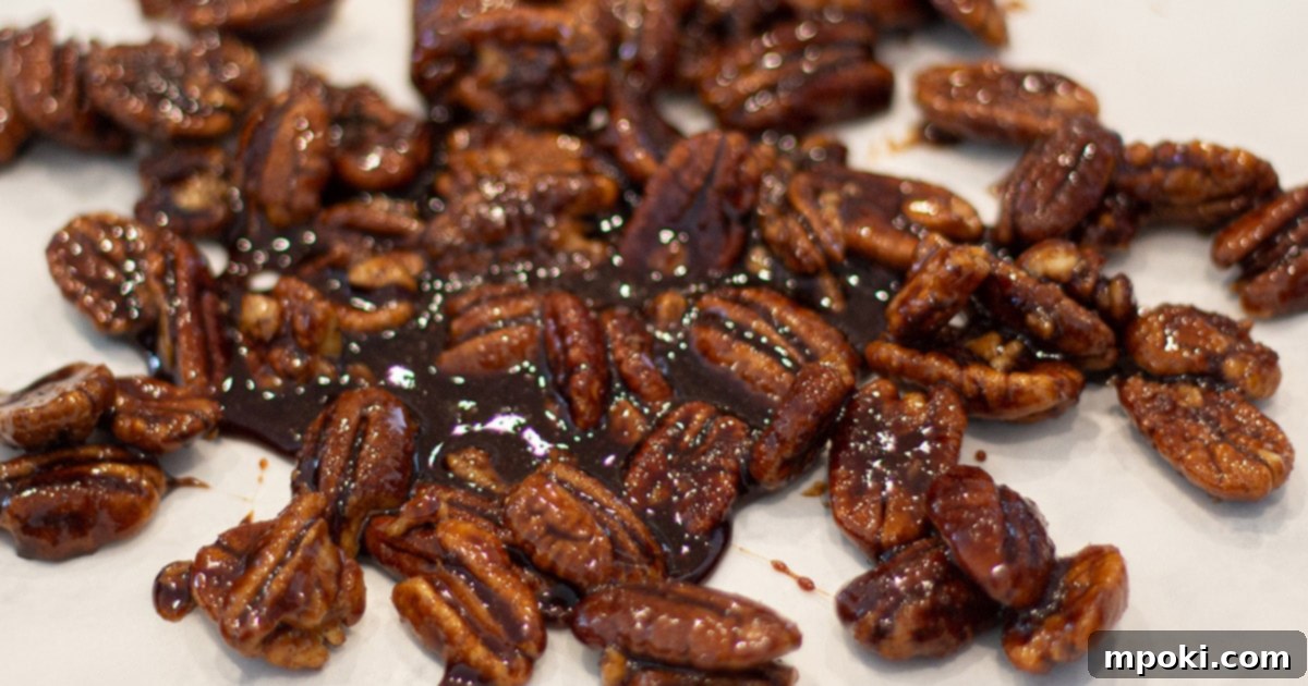 Delicious 5 Minute Candied Pecans 6 Candied pecans cooling on a piece of wax paper after being coated