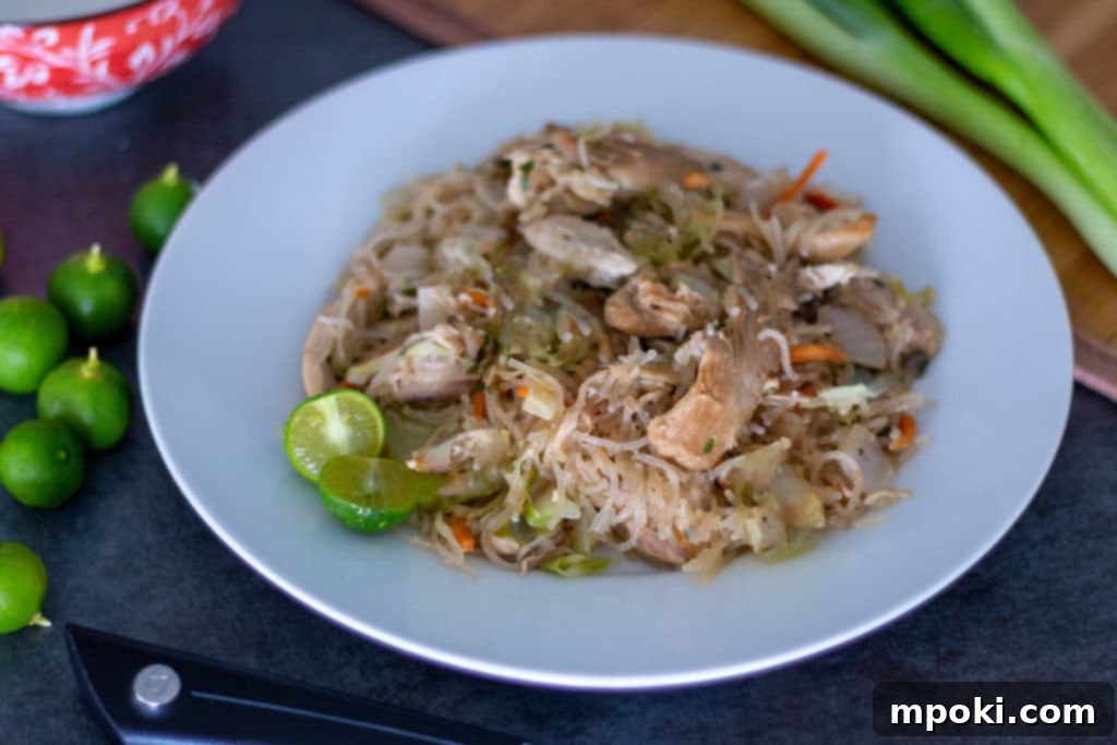 One-Pot Instant Pot Pancit Bihon 2 Pancit Bihon on a plate with calamansi