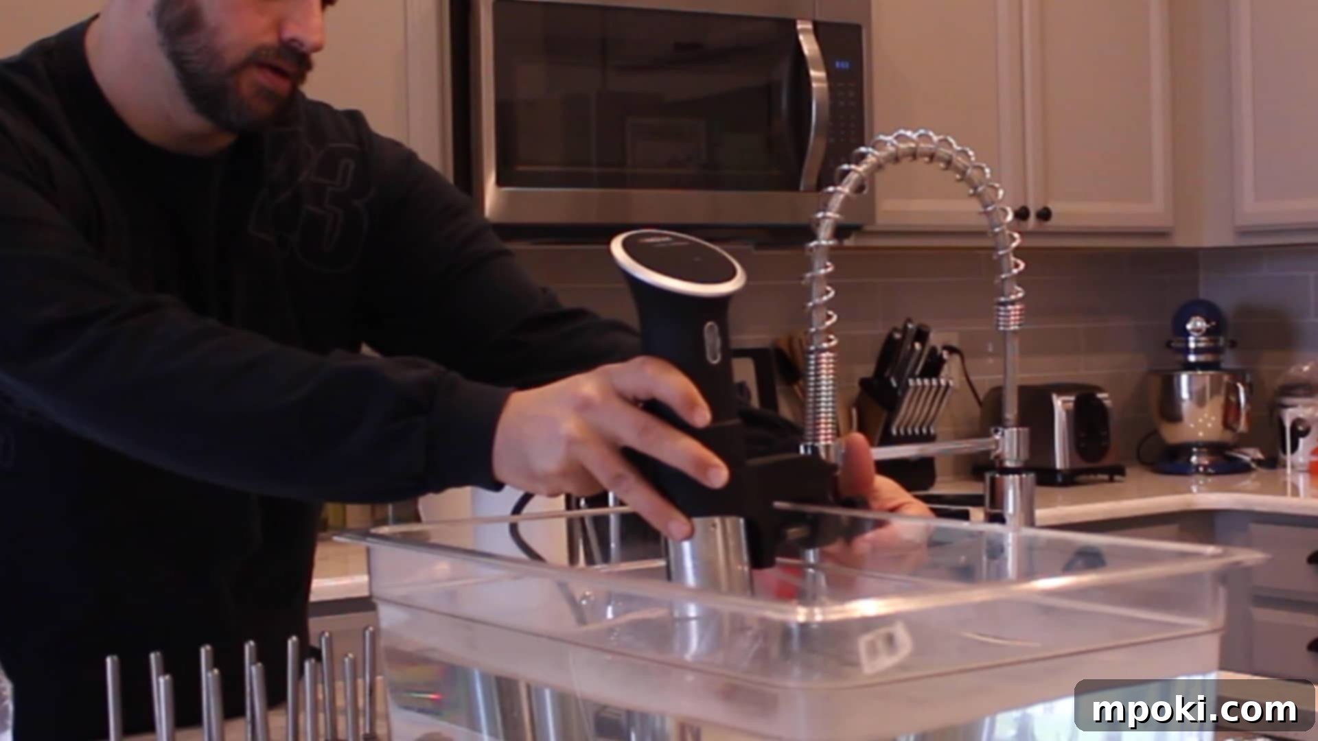 Perfect Sous Vide Prime Rib 3 Setting up the sous vide water bath in a large container with an immersion circulator