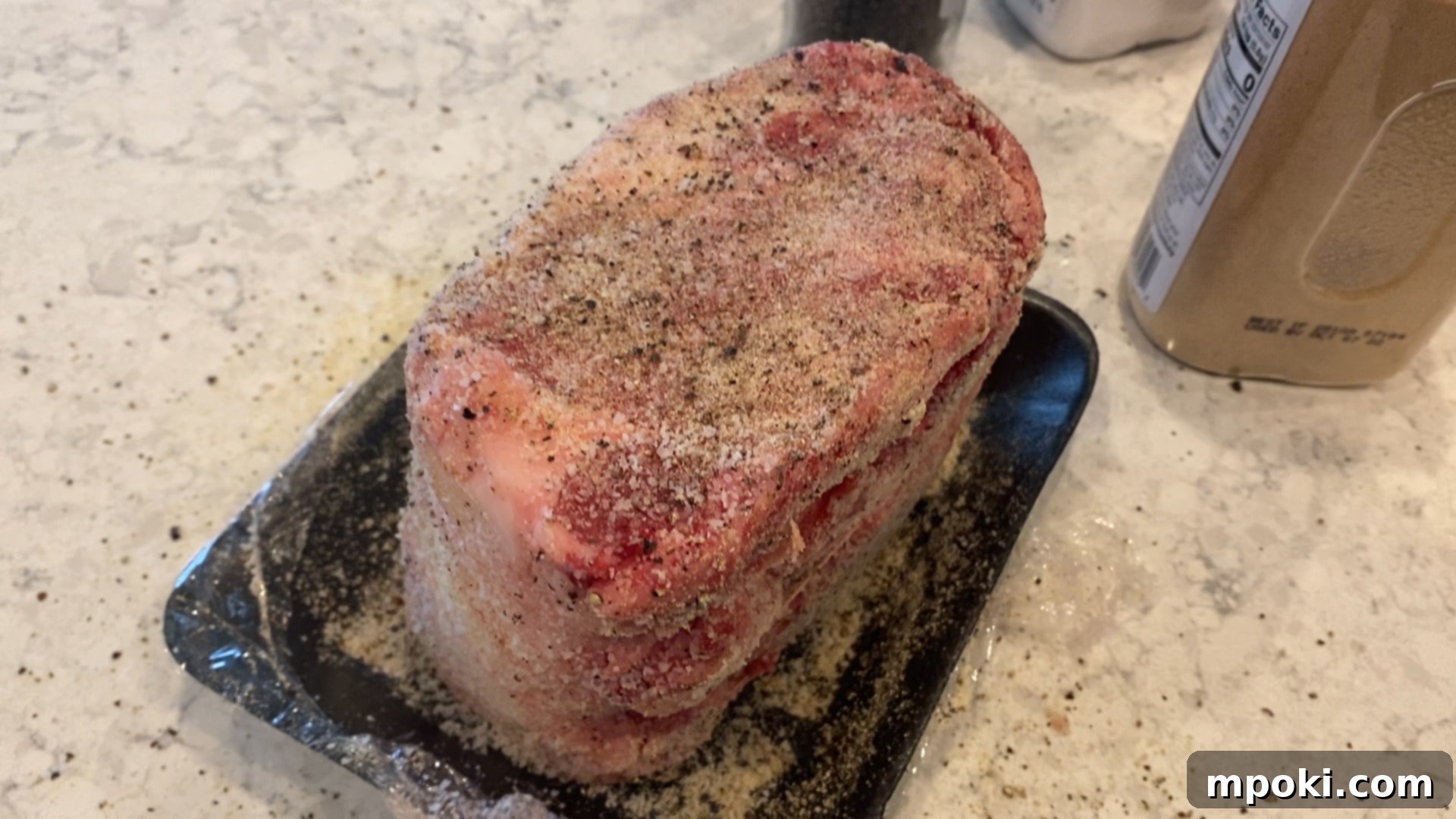 Perfect Sous Vide Prime Rib 4 Expertly seasoned prime rib roast on a counter, ready for the sous vide bath