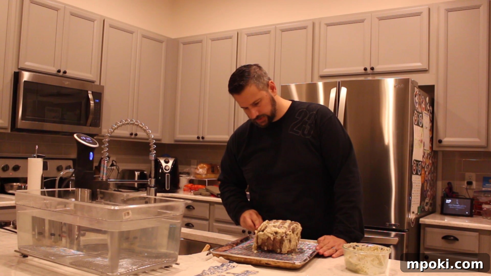 Perfect Sous Vide Prime Rib 9 Spreading aromatic herb butter generously over the warm sous vide rib roast