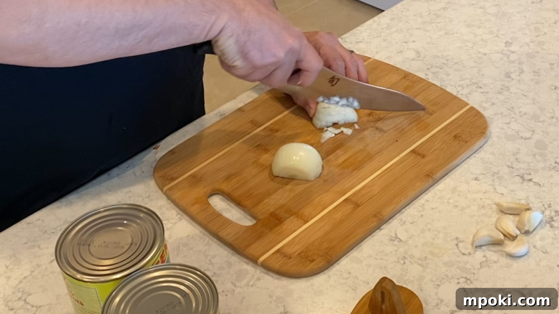 Effortless Homemade Meat Sauce 4 Dicing a white onion for meat sauce