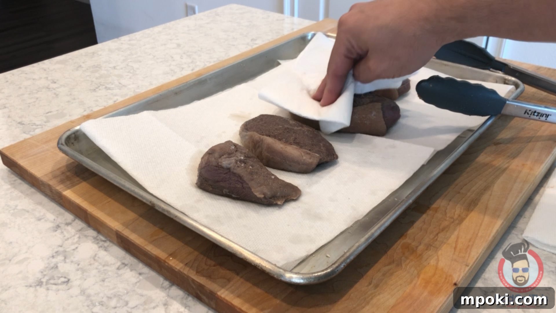 Charcoal Kissed Sous Vide Picanha 7 sous vide picanha steaks being patted dry with paper towels