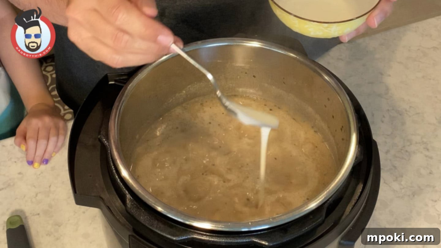 Quick and Creamy Instant Pot Beef Stroganoff 9 Thickening the Beef Stroganoff sauce with a cornstarch slurry in the Instant Pot.