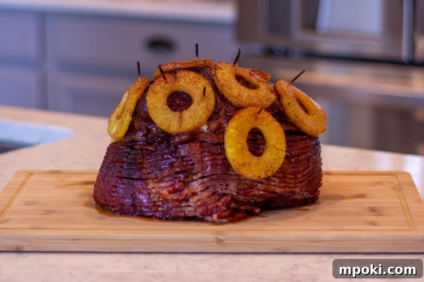 Decadent Honey Brown Sugar Glazed Spiral Ham 2 Delicious honey and brown sugar glazed spiral sliced ham, topped with vibrant pineapple rings, ready for a festive holiday feast.