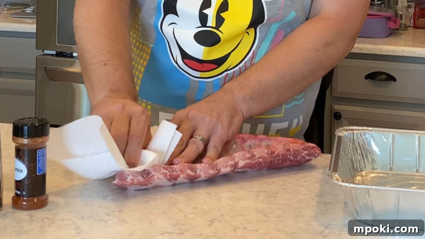 Slow Smoked Weber Kettle Ribs 3 Removing silver skin from a rack of baby back ribs