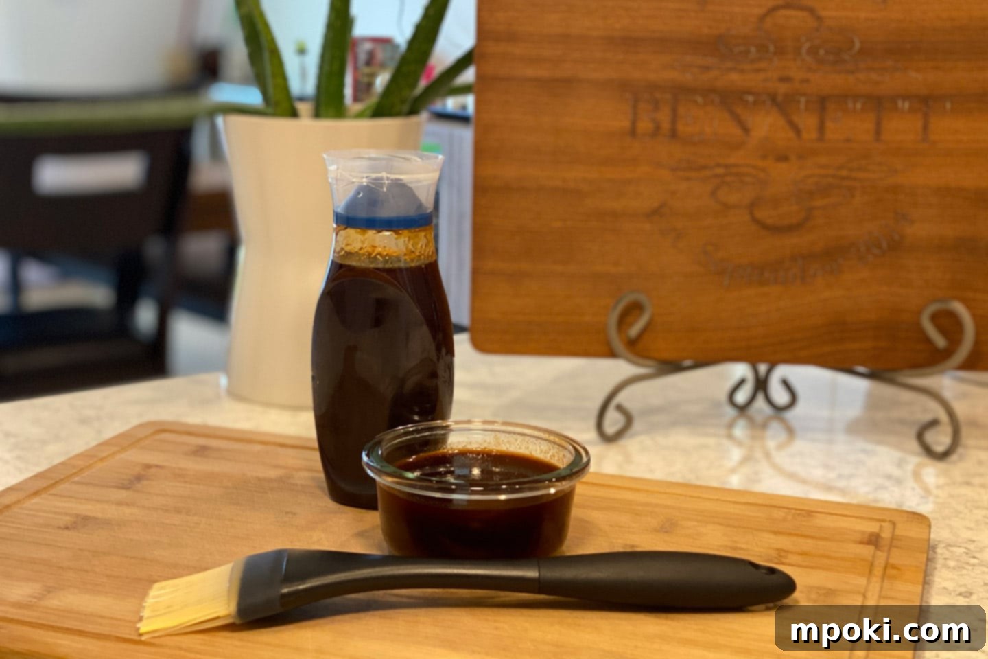 Foolproof BBQ Sauce Recipe 2 Delicious homemade BBQ sauce in a bowl with a brush, ready for grilling