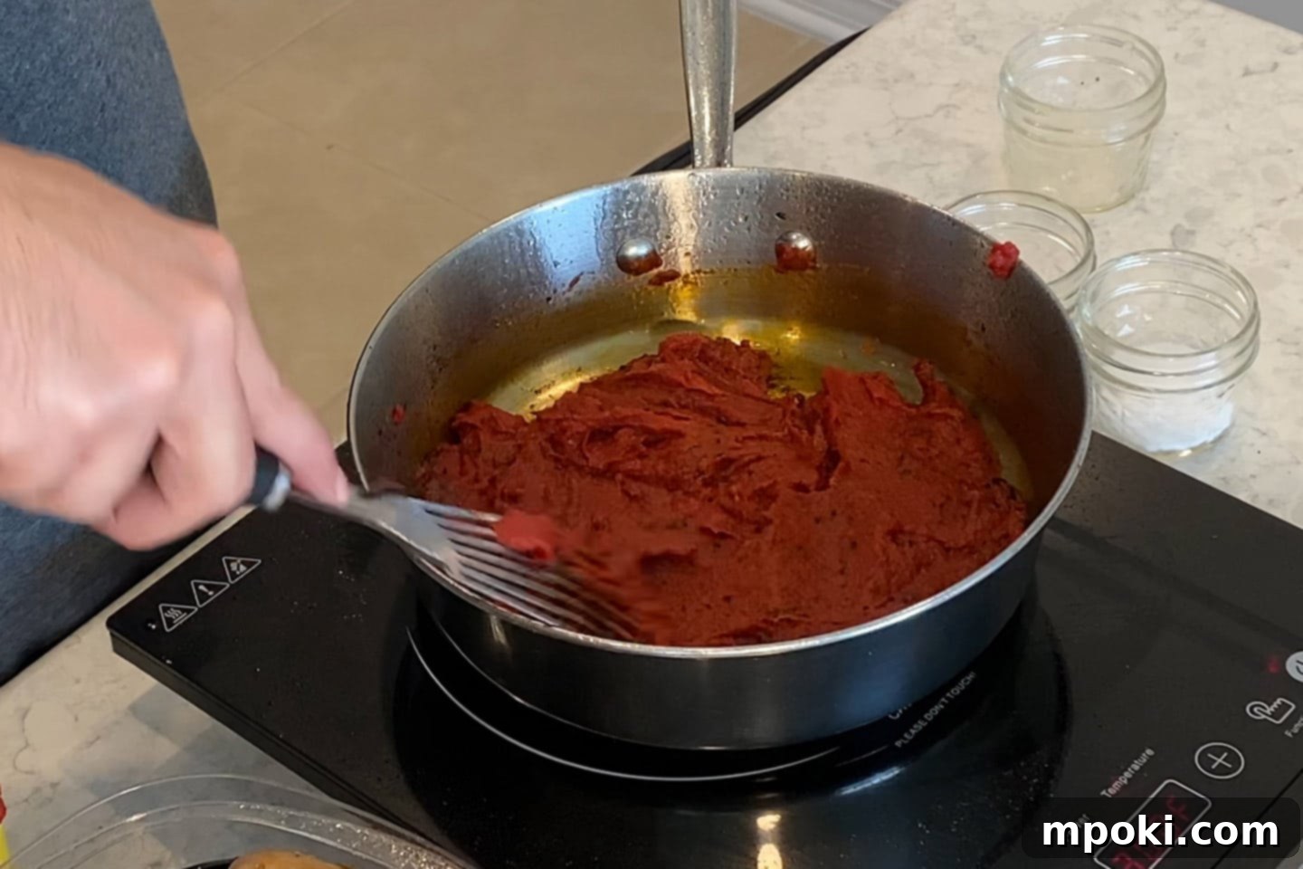 Grandma's Secret Sunday Sauce 6 cooking the tomato paste