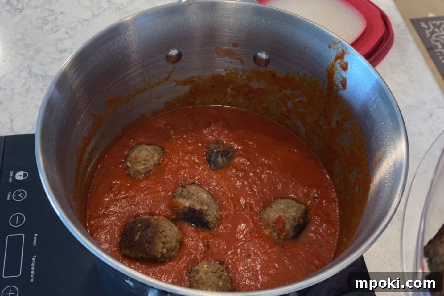 Grandma's Secret Sunday Sauce 7 meatballs in pot