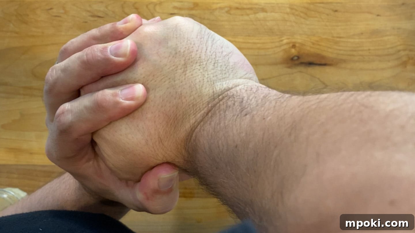 Aeropress Iced Vietnamese Coffee 7 Two hands pressing down on an Aeropress plunger, extracting coffee.