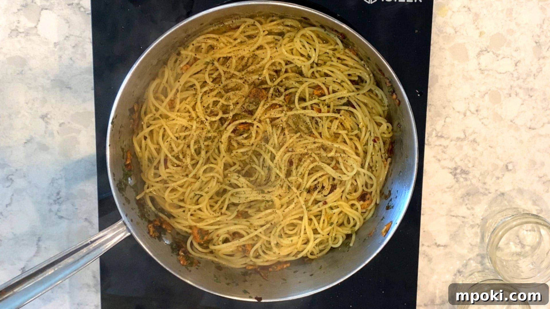 Sizzling Garlic Chili Pasta 6 Cooked pasta, garlic, and red pepper flakes in a pan