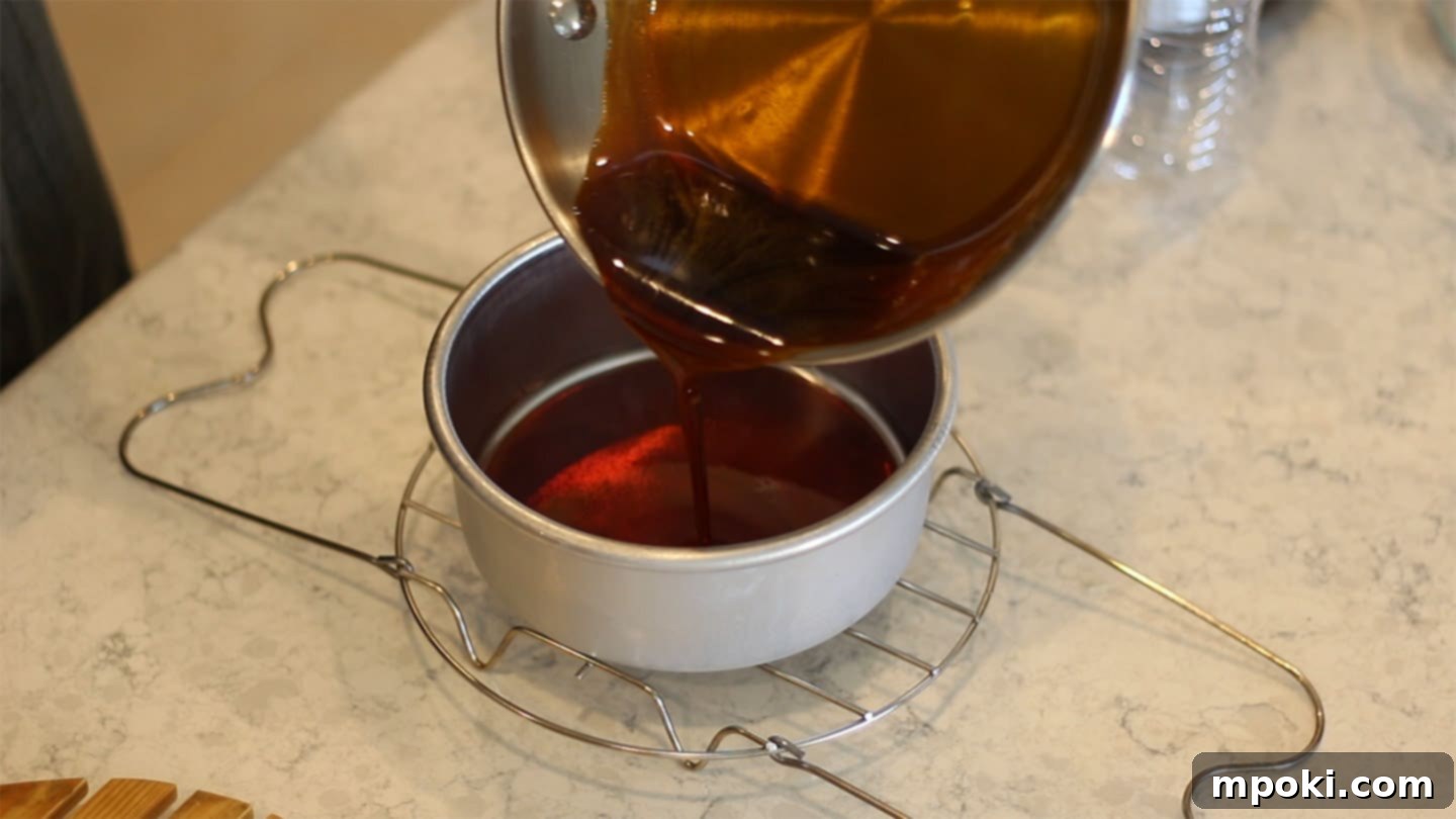 Authentic Leche Flan Quick Instant Pot Recipe 4 Hands carefully pouring the amber caramel into a 6-inch cake pan, coating the bottom evenly, a crucial step for Leche Flan.
