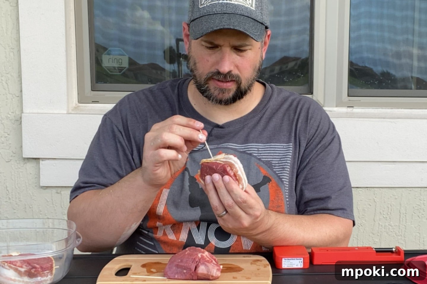Reverse Seared Bacon Wrapped Filet Mignon on the Grill 3 dad wrapping a filet in bacon