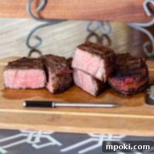 Reverse Seared Bacon Wrapped Filet Mignon on the Grill 7 bacon wrapped filets on a cutting board