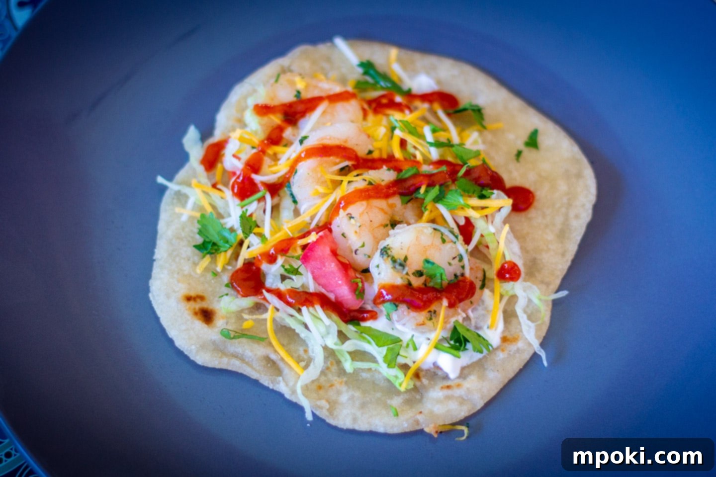 Your Go-To 30 Minute Shrimp Taco Dinner 2 Dad's easy shrimp taco recipe, beautifully arranged on a plate with fresh toppings, ready to eat