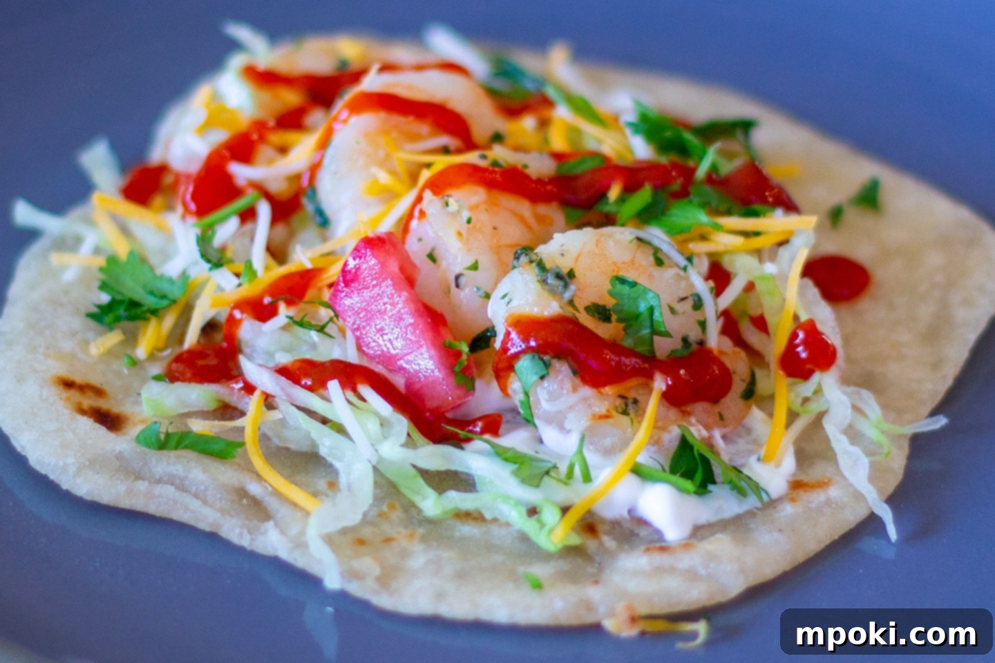 Your Go-To 30 Minute Shrimp Taco Dinner 5 A completed plate of Dad's easy shrimp tacos, showcasing fresh toppings and ready to be enjoyed