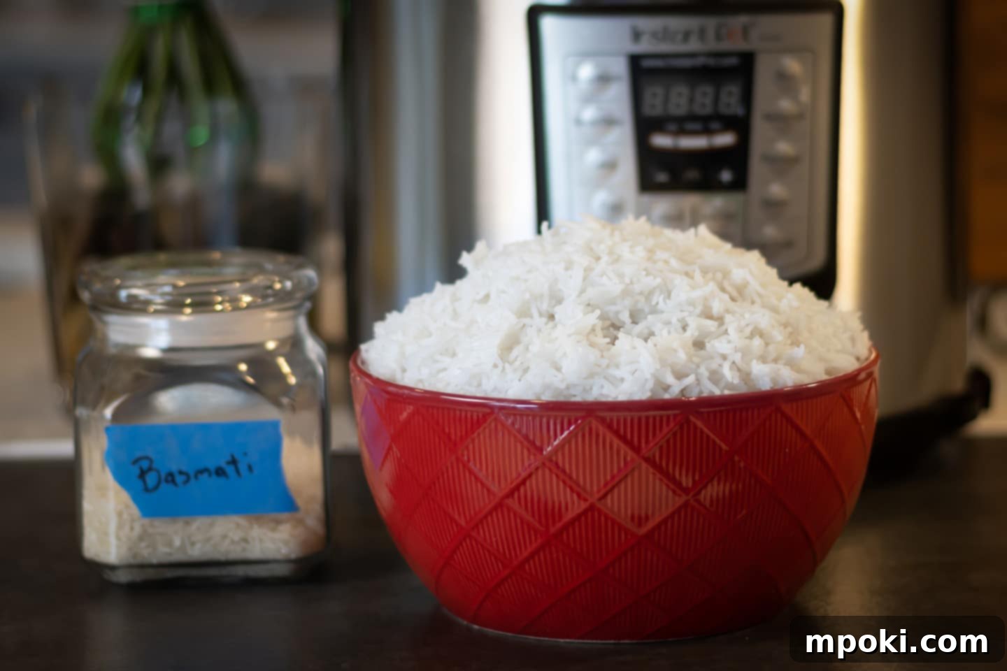 Unlock Perfect Basmati Rice with Your Instant Pot 2 Basmati Rice in front of an Instant Pot in a red bowl
