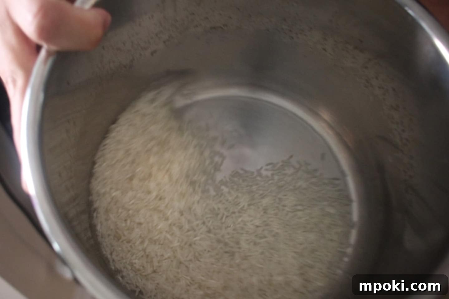 Unlock Perfect Basmati Rice with Your Instant Pot 4 swirling rice in an instant pot inner pot