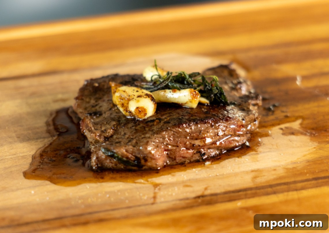 Cast Iron Seared Bavette 2 Bavette Steak cooked to perfection in a cast iron pan, ready to be sliced.